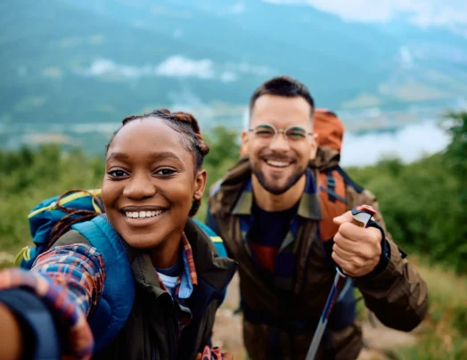 happy-couple-of-hikers-taking-selfie-on-top-of-the-2023-11-27-05-21-18-utc