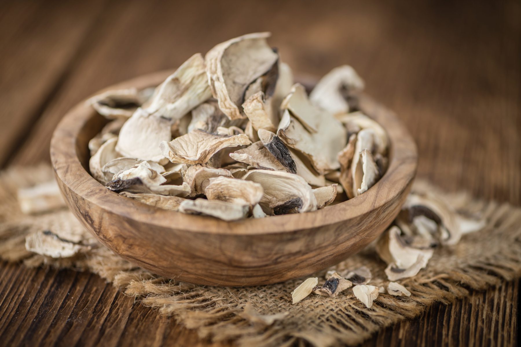 Portion of fresh Dried white Mushrooms  close-up shot; selective focus
